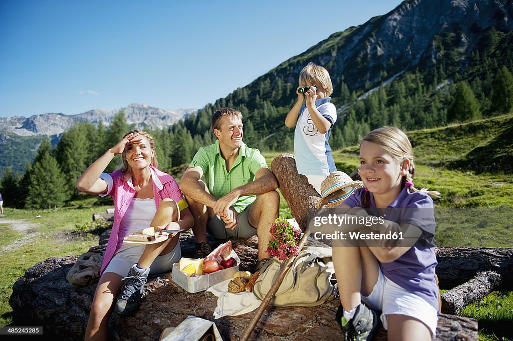 Austria, Salzburg State, Altenmarkt-Zauchensee, family with to children having a picnic