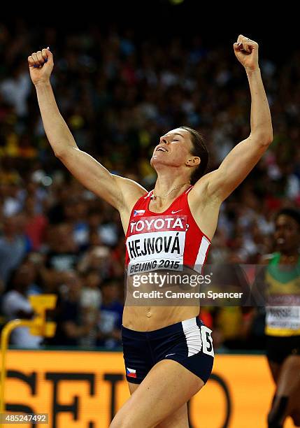 Zuzana Hejnova of the Czech Republic crosses the finish line to win gold in the Women's 400 metres hurdles final during day five of the 15th IAAF...