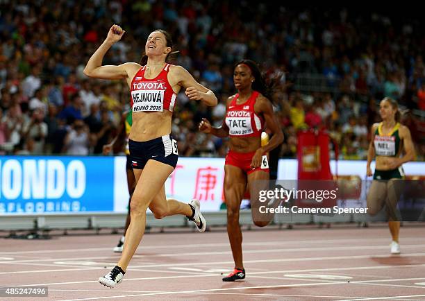 Zuzana Hejnova of the Czech Republic crosses the finish line to win gold in the Women's 400 metres hurdles final during day five of the 15th IAAF...