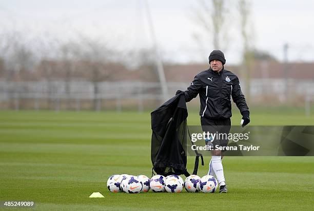 First Team Coach Steve Stone drops balls on the pitch during a training session at The Newcastle United Training Centre on April 17 in Newcastle upon...