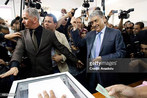 APRIl 17: Algerian presidential candidate Ali Benflis casts his ballot in the Algeria's presidential elections in Algiers, Algeria on April 17, 2014....