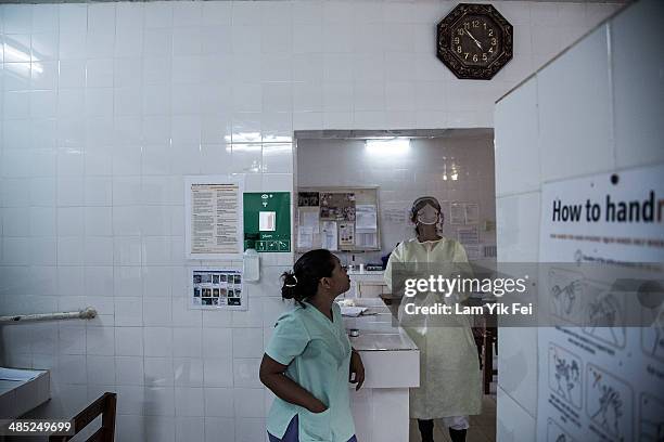 Honney, a Filipino nurse, waits for the test results of Lassa fever patients inside a laboratory at Gondama Referral Centre on March 3, 2014 in Bo...