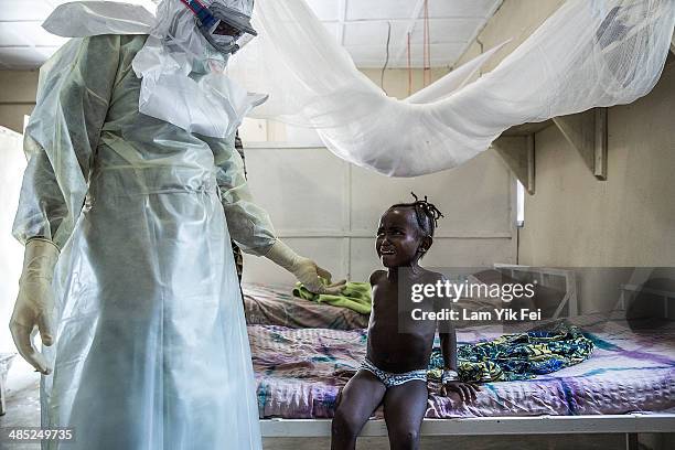 Healthcare workers in protective equipment work in Lassa isolation ward at Gondama Referral Centre on March 4, 2014 in Bo district, Sierra Leone. In...