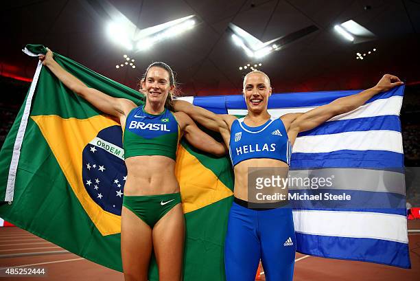 Silver medalist Fabiana Murer of Brazil and bronze medalist Nikoleta Kyriakopoulou of Greece celebrate after the Women's Pole Vault final during day...
