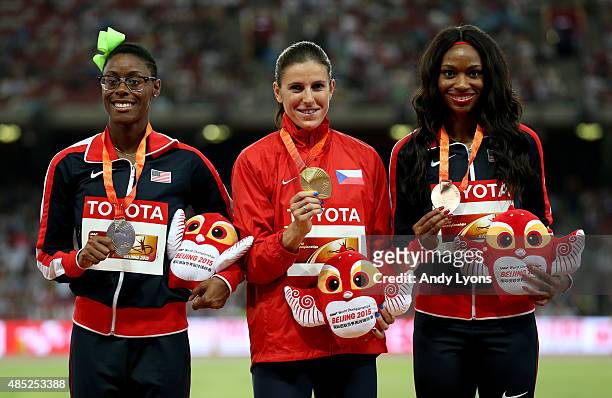 Silver medalist Shamier Little of the United States, gold medalist Zuzana Hejnova of the Czech Republic and bronze medalist Cassandra Tate of the...