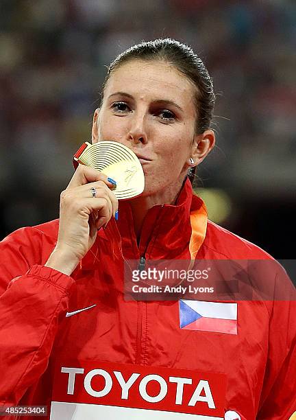 Gold medalist Zuzana Hejnova of the Czech Republic poses on the podium during the medal ceremony for the Women's 400 metres hurdles final during day...