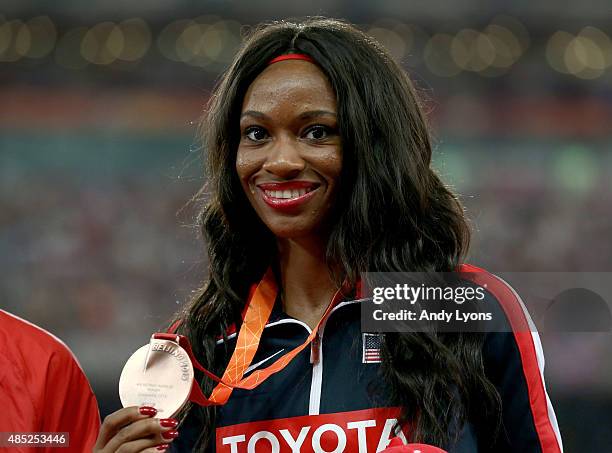 Bronze medalist Cassandra Tate of the United States poses on the podium during the medal ceremony for the Women's 400 metres hurdles final during day...