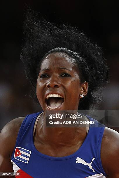 Cuba's Yarisley Silva celebrates after the winning jump during the final of the women's pole vault athletics event at the 2015 IAAF World...