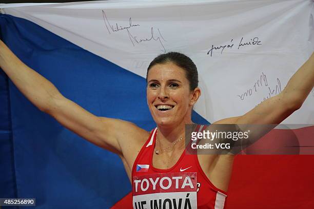Zuzana Hejnova of the Czech Republic celebrates after winning gold in the Women's 400 metres hurdles final during day five of the 15th IAAF World...