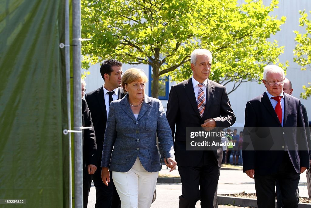 German Chancellor Angela Merkel visits asylum shelter in Dresden