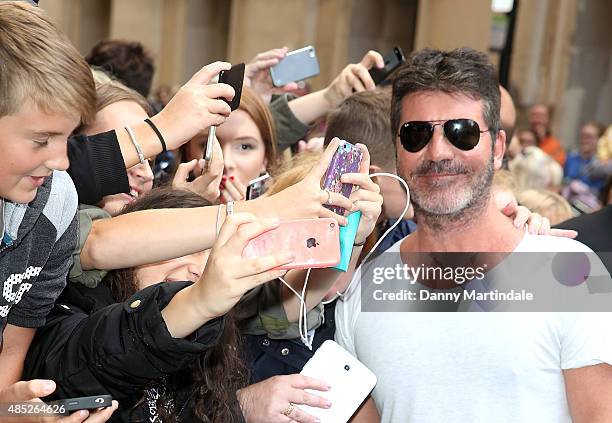 Simon Cowell meets fans at the press launch of "The X Factor" on August 26, 2015 in London, England.