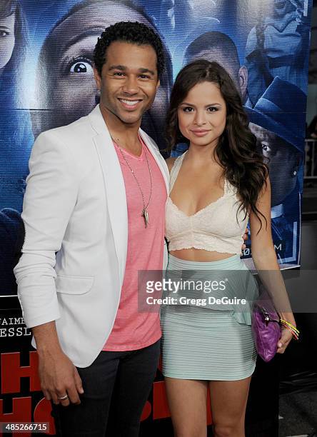 Actor Corbin Bleu and Sasha Clements arrive at the Los Angeles premiere of "A Haunted House 2" at Regal Cinemas L.A. Live on April 16, 2014 in Los...