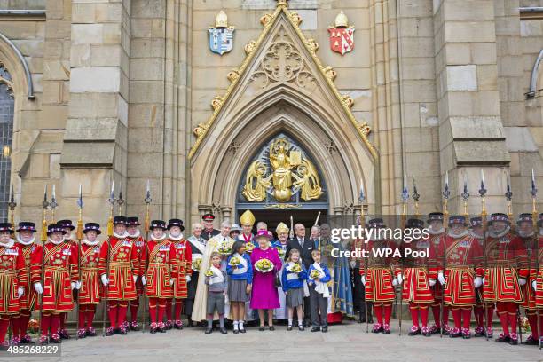 Queen Elizabeth II and Prince Philip, Duke of Edinburgh leave Blackburn Cathedral after attending the Royal Maundy Service on April 17, 2014 in...