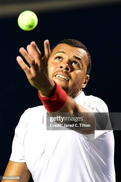 Jo-Wilfried Tsonga of France prepares to serve to Denis Istomin of Uzbekistan during the second day of the Winston-Salem Open at Wake Forest...