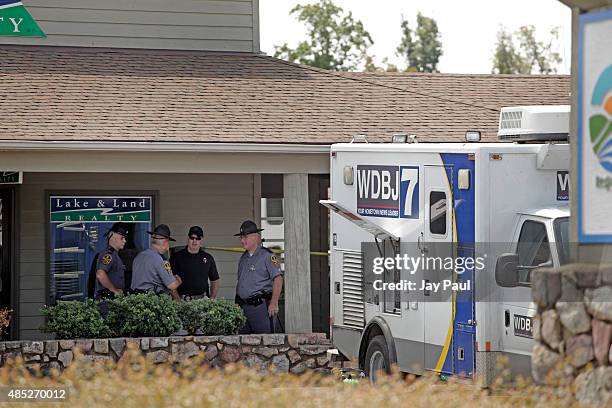 Police work the crime scene at Bridgewater Plaza on Smith Mountain Lake on August 26, 2015 in Moneta, Virginia. Two employees of WDBJ TV were killed...