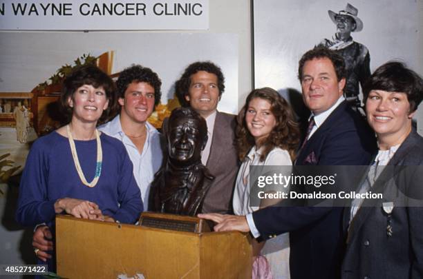 Actress Marisa Wayne, Patrick Wayne and the rest of the Wayne family poses for a portrait at the opening of the John Wayne Cancer Institute in 1981...