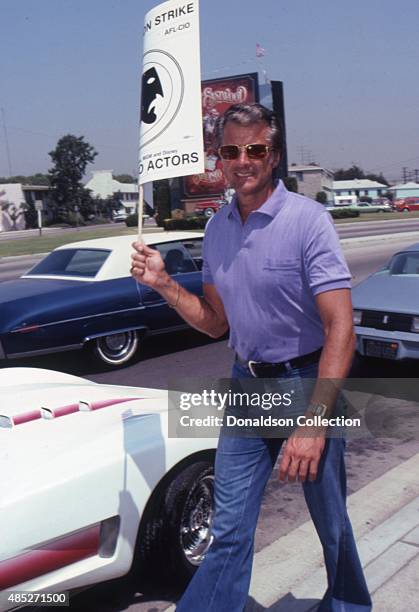 Actor Lyle Waggoner holds a protest sign in July 1980 in Los Angeles, California.