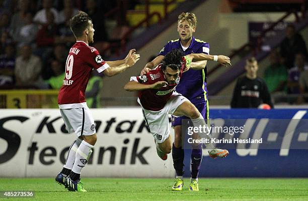 Bjoern Kluft of Aue pushes Markus Schwabl of Aalen during the Third League match between FC Erzgebirge Aue and VFR Aalen at...