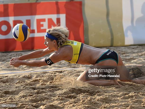 Laura Ludwig of Germany dives for a ball during day 2 of the FIVB Olsztyn Grand Slam on August 26, 2015 in Olsztyn, Poland.