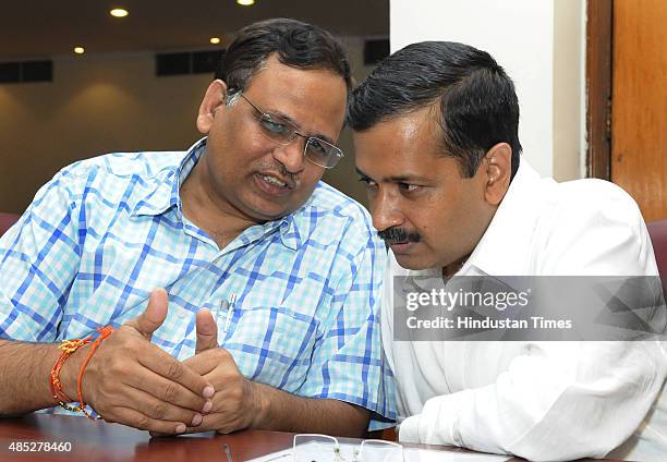 Delhi Chief Minister Arvind Kejriwal with Delhi Health Minister Satyendra Jain before their meeting with Urban Development Minister M. Venkaiah Naidu...