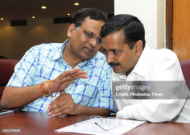 Delhi Chief Minister Arvind Kejriwal with Delhi Health Minister Satyendra Jain before their meeting with Urban Development Minister M. Venkaiah Naidu...