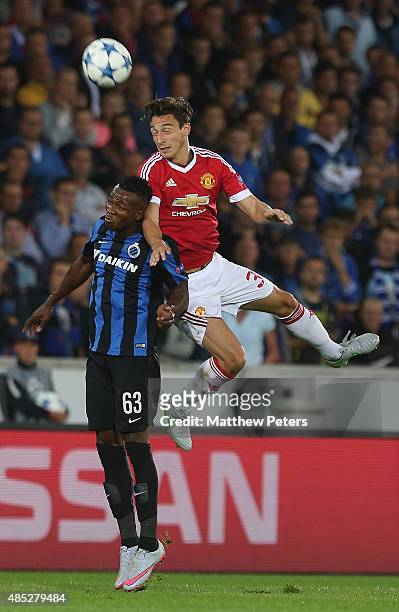 Matteo Darmian of Manchester United in action with Bolingoli Mbombo of Club Brugge during the UEFA Champions League play-off second leg match between...