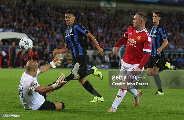 Wayne Rooney of Manchester United scores their second goal during the UEFA Champions League play-off second leg match between Club Brugge and...