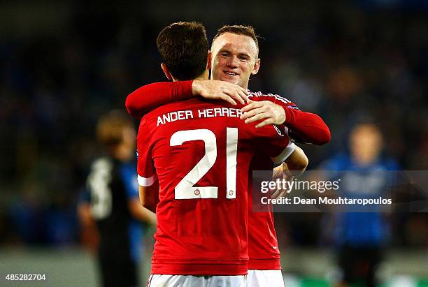 Wayne Rooney of Manchester United congratulates fellow goalscorer Ander Herrera of Manchester United during the UEFA Champions League qualifying...