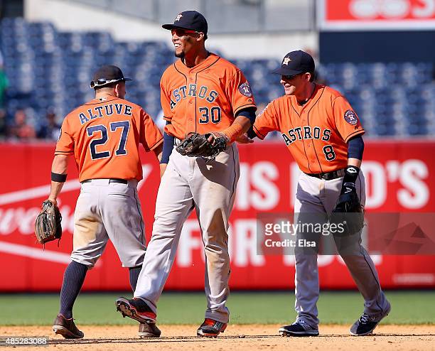 Jose Altuve,Carlos Gomez and Jed Lowrie of the Houston Astros celebrate the 6-2 win over the New York Yankees on August 26, 2015 at Yankee Stadium in...