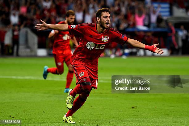 Hakan Calhanoglu of Bayer Leverkusen celebrates after scoring his teams first goal during the UEFA Champions League qualifying play off round 2nd leg...