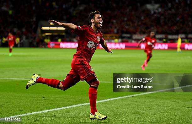 Hakan Calhanoglu of Bayer Leverkusen celebrates after scoring his teams first goal during the UEFA Champions League qualifying play off round 2nd leg...