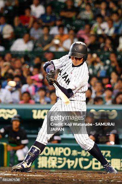 Kotaro Kiyomiya of Japan bats in the bottom half of the third inning in the send-off game between U-18 Japan and Collegiate Japan before the 2015...