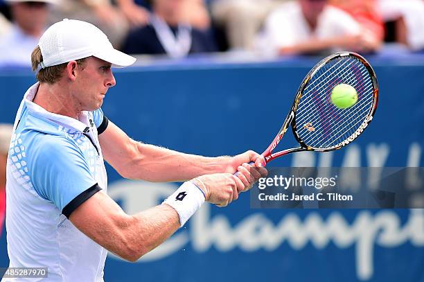 Kevin Anderson of South Africa returns a shot from Jerzy Janowicz of Poland during the third day of the Winston-Salem Open at Wake Forest University...