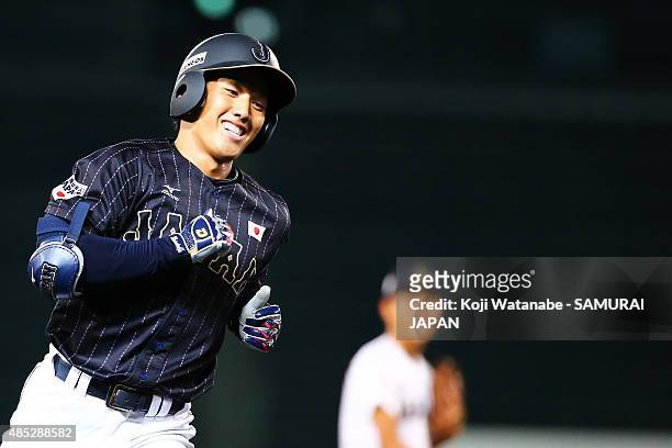 Outfielder Masataka Yoshida of Collegiate Japan hits a homer in the top half of the fouth inning in the send-off game between U-18 Japan and...