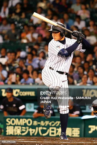 Kotaro Kiyomiya of Japan bats in the bottom half of the six inning in the send-off game between U-18 Japan and Collegiate Japan before the 2015 WBSC...