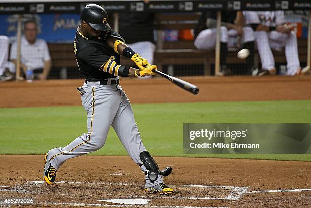 Andrew McCutchen of the Pittsburgh Pirates hits a three run home run during a game against the Miami Marlins at Marlins Park on August 26, 2015 in...