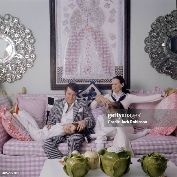 Family portrait of the Coopers as they play on a sofa in their home, Southampton, Long Island, New York, March 30, 1972. American author and actor...