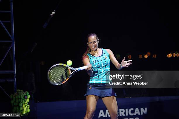 Tennis player Monica Puig plays tennis at Rally On The River presented by American Express, featuring Maria Sharapova, John Isner, Monica Puig and DJ...