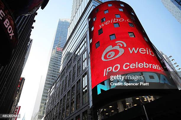 The Nasdaq exchange advertises China's Weibo in Times Square moments before it began trading on the Nasdaq exchange under the ticker symbol WB on...