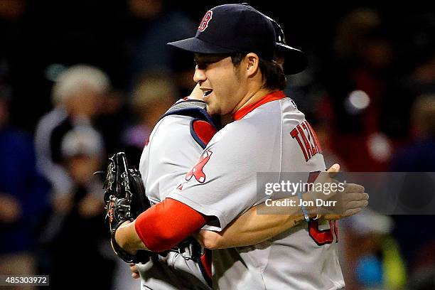 Junichi Tazawa of the Boston Red Sox and Blake Swihart celebrate their win over the Chicago White Sox at U.S. Cellular Field on August 26, 2015 in...