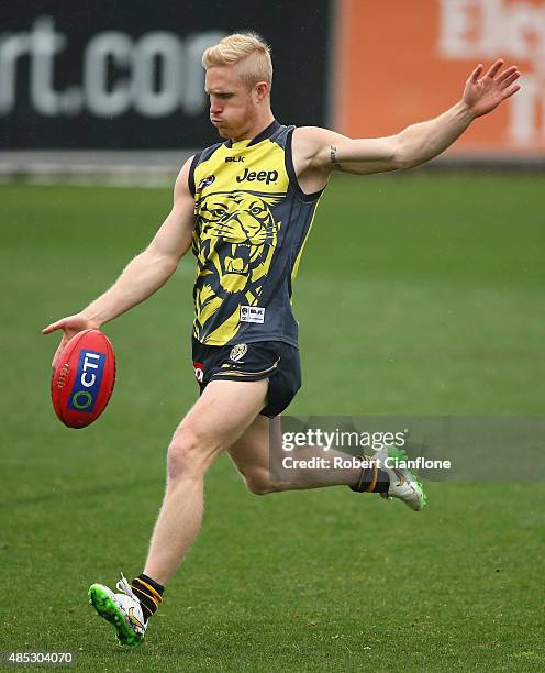 Steven Morris of the Tigers kicks on goal during a Richmond Tigers AFL training session at the ME Centre on August 27, 2015 in Melbourne, Australia.