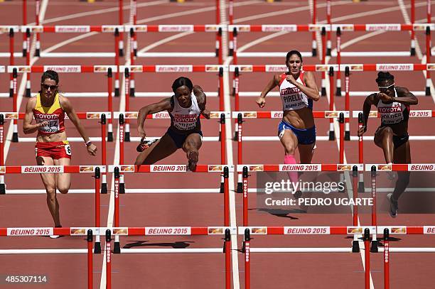 Spain's Caridad Jerez, Britain's Tiffany Porter, Paraguay's Ana Camila Pirelli and Canada's Nikkita Holder compete in a heat of the women's 100...