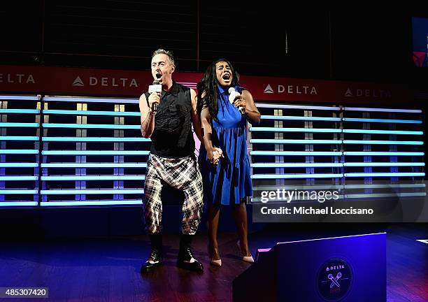 Alan Cumming and Uzo Aduba perform at the 2nd Annual Delta OPEN Mic With Serena Williams at Arena on August 26, 2015 in New York City.