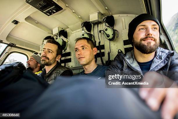 helicopter pilots and wingsuit fliers liftoff in bern canton, switzerland - wing suit stock pictures, royalty-free photos & images