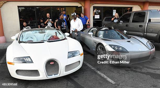 One of boxer Floyd Mayweather Jr.'s Bugattis and his new USD 4.8 million Koenigsegg CCXR Trevita car are parked outside the Mayweather Boxing Club...