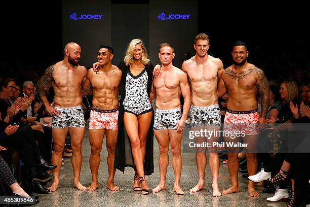 All Blacks and All Blacks Sevens players DJ Forbes, Malakai Fekitoa, Andy Ellis, Scott Curry and Hika Elliot pose with Nikki Phillips during the...