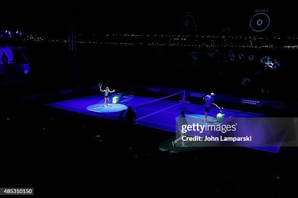 Tennis players Monica Puig and John Isner partecipate in the 2015 American Express Rally On the River at Pier 97 on August 26, 2015 in New York City.