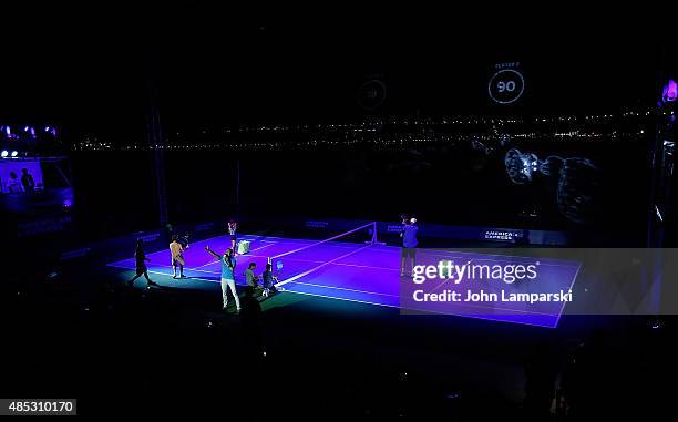 Tennis players Monica Puig and John Isner partecipate in the 2015 American Express Rally On the River at Pier 97 on August 26, 2015 in New York City.