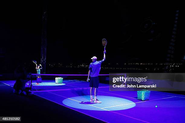 Tennis players Monica Puig and John Isner partecipate in the 2015 American Express Rally On the River at Pier 97 on August 26, 2015 in New York City.