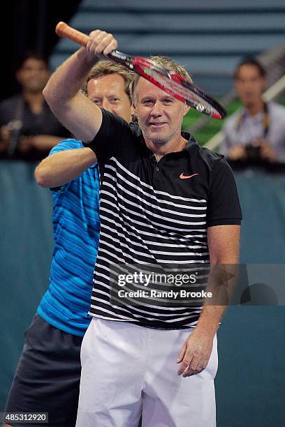 Patrick McEnroe gets a back rub from doubles partner Jonas Bjorkman during their Johnny Mac Tennis Project 2015 Benefit Match at Randall's Island on...